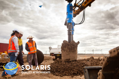 Auger digging up ground