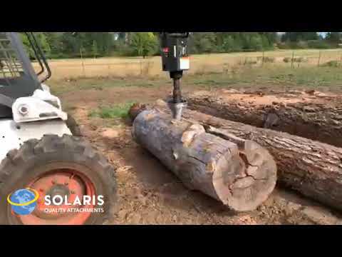 cone splitter drilling into and splitting a large log